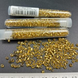 - Tube 6gr. Rocailles verre ~3mm Or Silver line