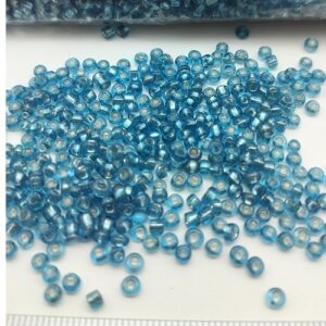 Sachet 500 gr. Rocailles verre ~2mm Turquoise Silver line
