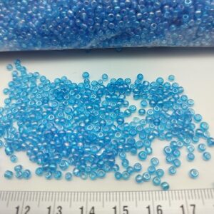 -Sachet 500 gr. Rocailles verre ~2mm Turquoise Rainbow